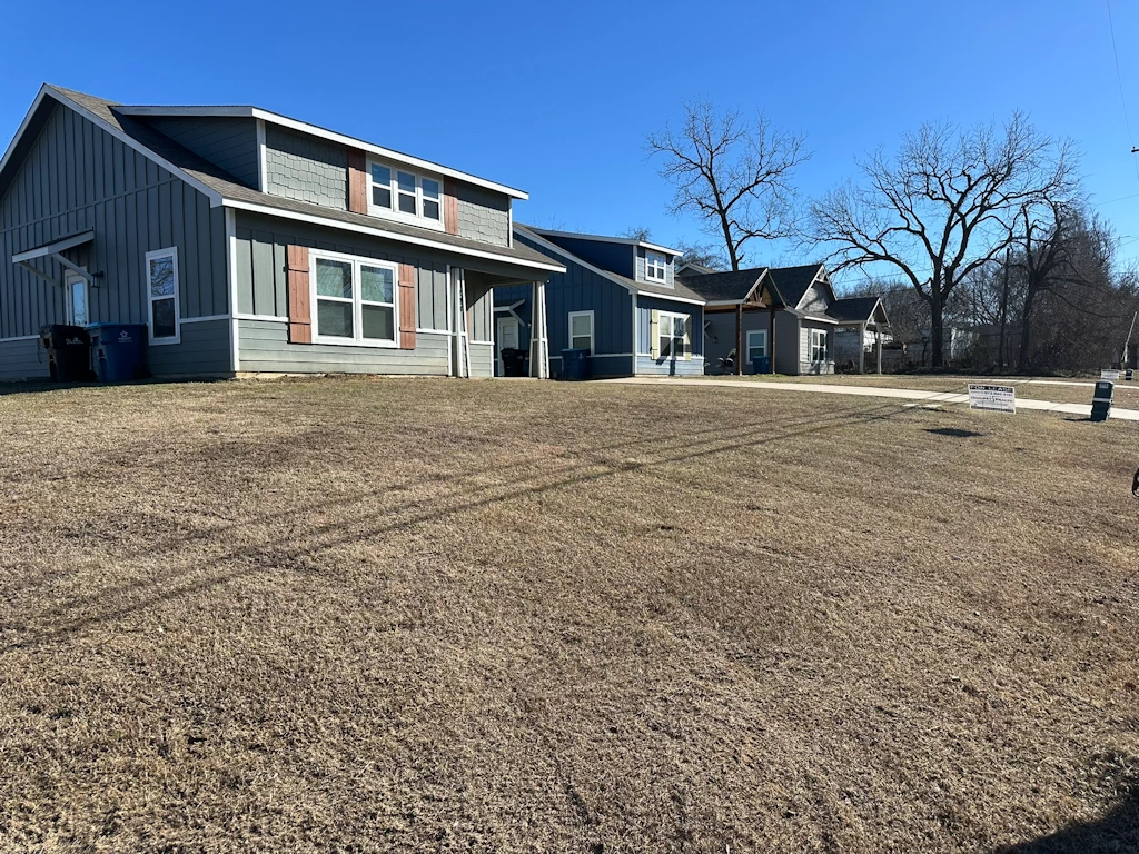 Weed control and fertilization service for a residential lawn in Denison TX by Yard Doctor